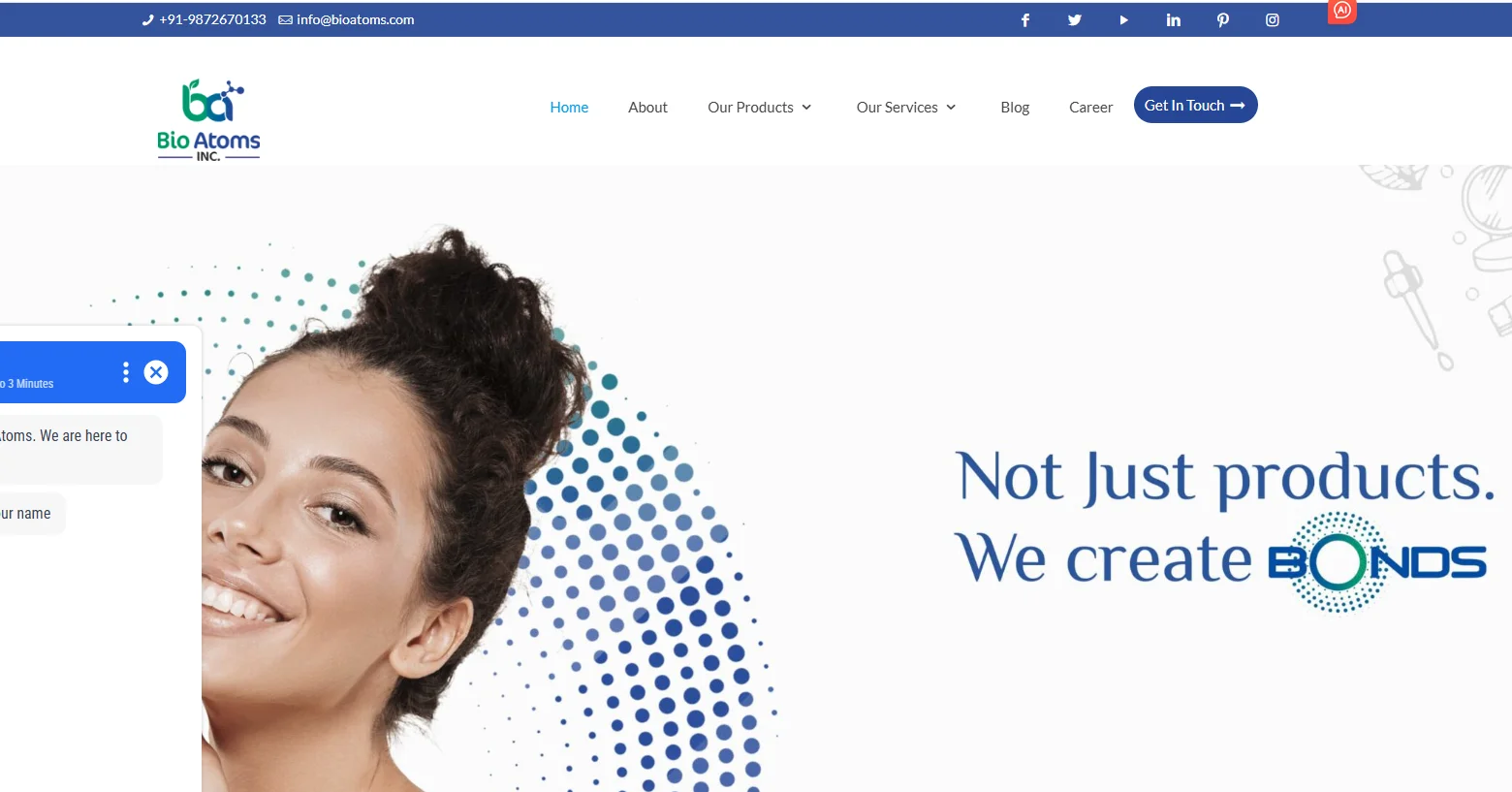 Bio Atoms homepage displaying company logo, contact information, navigation menu, and slogan 'Not just products. We create bonds'.